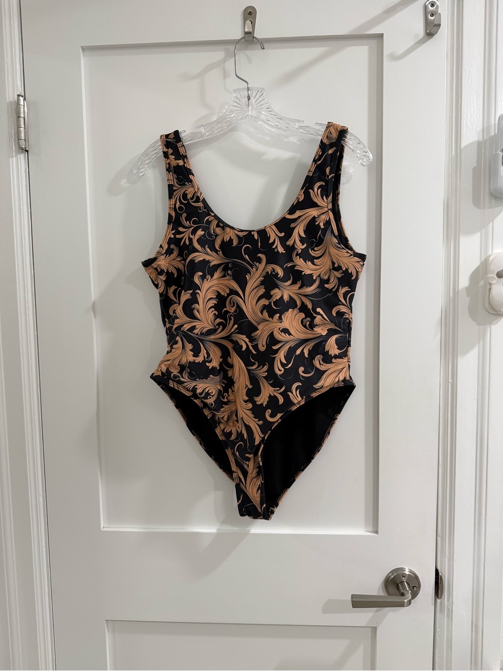 Fashion Nova black one piece swimsuit w/ tan-ish filigree pattern (fair)